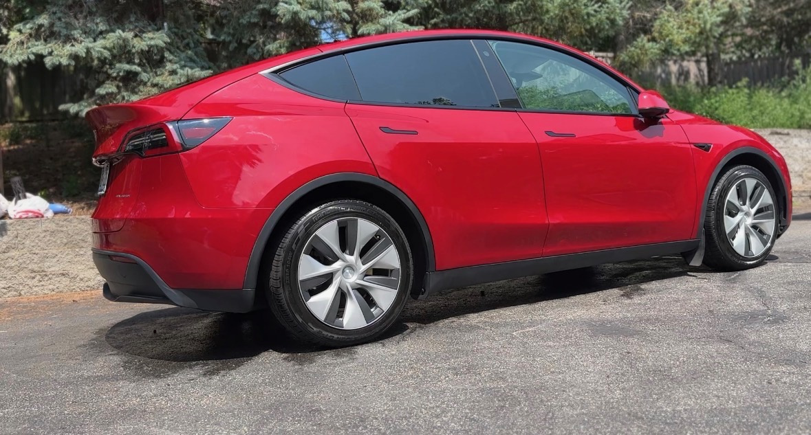 Side profile of a detailed red Tesla Model Y